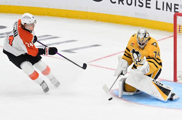 Pittsburgh Penguins goaltender Stuart Skinner (74) shots the shot of Philadelphia Flyers right wing Owen Tippett (74) in the second period of the 3-2 Flyers win of game one in the opening round of the Eastern Conference playoffs at PPG Paints Arena in Pittsburgh on Saturday, April 18, 2026.  PIT2026041813 ARCHIExCARPENTER