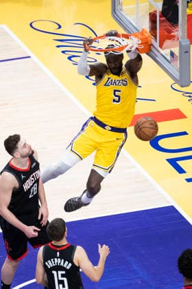 (260419) -- LOS ANGELES, April 19, 2026 -- Los Angeles Lakers Deandre Ayton (top) dunks against the Houston Rockets during the 2025-2026 NBA, Basketball Herren, USA first-round playoff series basketball match between Los Angeles Lakers and Houston Rockets in Los Angeles, the United States, April 18, 2026. (Photo by Xinhua) (SP)U.S.-LOS ANGELES-BASKETBALL-NBA-PLAYOFFS-LAKERS VS ROCKETS RingoxChiu 