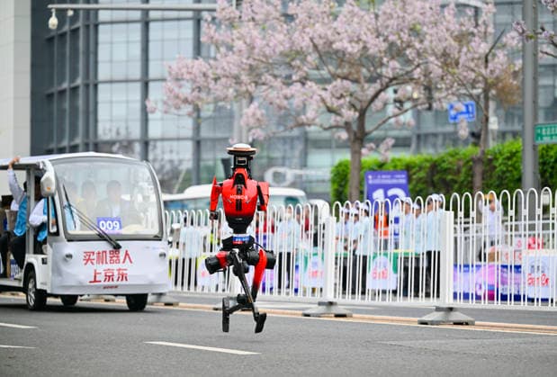 BEIJING, CHINA - APRIL 19: Honor s Lightning humanoid robot competes in the 2026 Beijing E-Town Humanoid Robot Half-marathon on April 19, 2026 in Beijing, China. A remotely controlled Lightning robot from one Honor team was the first to cross the finish line, clocking 48 minutes and 19 seconds, according to China Media Group (CMG). Based on the event s weighting rules, another robot from Honor s autonomous navigation team won the championship with a net time of 50 minutes and 26 seconds.  Copyright: xVCGx 111635822685