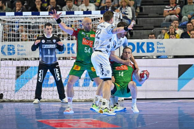 GER, Lanxess Arena Koeln, HBL, LIDL FINAL4, Men, Match for 3rd place, TBV Lemgo Lippe vs SC Magdeburg 19 04 2026, Lanxess Arena , Koeln , GER, Lanxess Arena Koeln, HBL, LIDL FINAL4, Men, Match for 3rd place, TBV Lemgo Lippe vs SC Magdeburg , in the picture Omar Ingi Magnusson SC Magdeburg 14 , Oscar Bergendahl SC Magdeburg 54 , in a duel against Adam Nyfjäll Nyfjaell TBV Lemgo 22 , nordphotoxGmbHx xMeuter nph00351