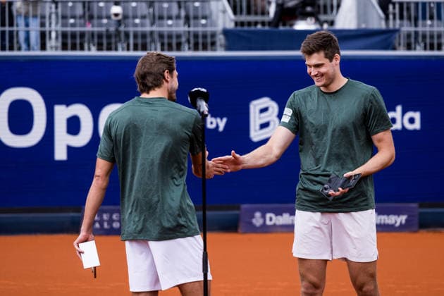 MUNICH, GERMANY - APRIL 19: Jakob Schnaitter (GER) Mark Wallner (GER) high five during the trophy ceremony of the BMW Open by Bitpanda Doubles match between Jakob Schnaitter (GER) Mark Wallner (GER) vs Theo Arribage (FRA) Albano Olivetti (FRA) at MTTC Iphitos on April 19, 2026 in Munich, Germany. Bavaria Germany Copyright: xSteffiexWunderlx