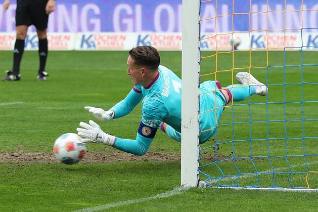 19 04 2026, Soccer, Men, 2 BL, Season 2025 2026, Eintracht Braunschweig vs Hertha BSC Berlin Goalkeeper Ron Thorben Hoffmann Eintracht Braunschweig saves penalty kick from Fabian Reese Hertha BSC DFL DFB REGULATIONS PROHIBIT ANY USE OF PHOTOGRAPHS as IMAGE SEQUENCES and or QUASI VIDEO Stadion an der Hamburger Straße Niedersachsen Germany