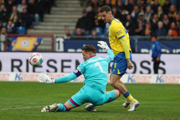 19 04 2026, Soccer, Men, 2 BL, Season 2025 2026, Eintracht Braunschweig vs Hertha BSC Berlin Goalkeeper Ron Thorben Hoffmann Eintracht Braunschweig , Andi Hoti Eintracht Braunschweig DFL DFB REGULATIONS PROHIBIT ANY USE OF PHOTOGRAPHS as IMAGE SEQUENCES and or QUASI VIDEO Stadion an der Hamburger Straße Niedersachsen Germany