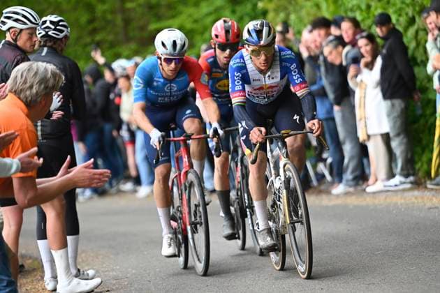 Amstel Gold Race 2026 Cycling Race VALKENBURG, THE NETHERLANDS - APRIL 19 : Evenepoel Remco (BEL) of Red Bull - BORA - Hansgrohe, Gregoire Romain (FRA) of Groupama - FDJ United, Skjelmose Mattias (DEN) of Lidl - Trek during the 60th edition of Amstel Gold Race an UCI World Tour 1.UWT one day cycling road race for Men Elite of 220 km with start in Maastricht and finish in Valkenburg on April 19, 2026 in Valkenburg, The Netherlands, 19 04 2026 ( Motordriver Kenny Verfaillie - Valkenburg The Netherlands  Copyright: xVincentxKalutx
