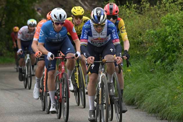 Amstel Gold Race 2026 Cycling Race VALKENBURG, THE NETHERLANDS - APRIL 19 : Gregoire Romain (FRA) of Groupama - FDJ United, Evenepoel Remco (BEL) of Red Bull - BORA - Hansgrohe during the 60th edition of Amstel Gold Race an UCI World Tour 1.UWT one day cycling road race for Men Elite of 220 km with start in Maastricht and finish in Valkenburg on April 19, 2026 in Valkenburg, The Netherlands, 19 04 2026 ( Motordriver Kenny Verfaillie - Valkenburg The Netherlands  Copyright: xDarioxBelingherix