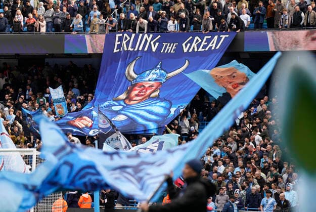 Manchester, England, 19th April 2026. Manchester City fans show a TIFO about Erling Haaland of Manchester City during the Manchester City vs Arsenal Premier League match at the Etihad Stadium, Manchester. Picture credit should read: Andrew Yates Sportimage EDITORIAL USE ONLY. No use with unauthorised audio, video, data, fixture lists, club league logos or live services. Online in-match use limited to 120 images, no video emulation. No use in betting, games or single club league player publications. SPI_037_AY_Man_City_Arsenal SPI-4704-0037