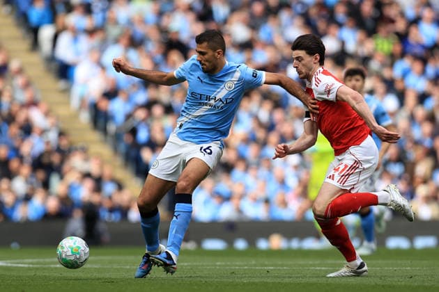 19th April 2026; Etihad Stadium, Manchester, Lancashire, England; Premier League Football, Manchester City versus Arsenal ; Rodri of Manchester City holds off a challenge from Declan Rice of Arsenal DavidxBlunsden