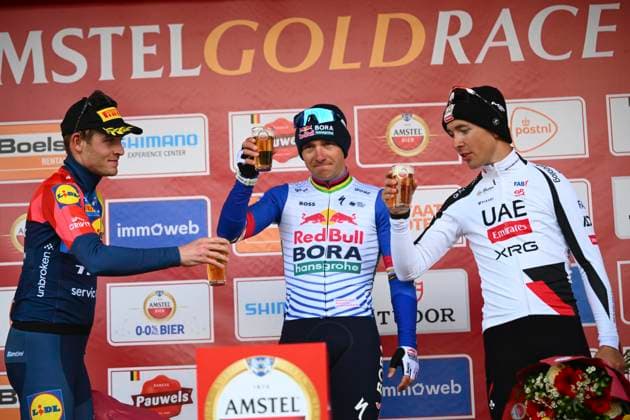 Amstel Gold Race 2026 Cycling Race VALKENBURG, THE NETHERLANDS - APRIL 19 : Skjelmose Mattias (DEN) of Lidl - Trek, Evenepoel Remco (BEL) of Red Bull - BORA - Hansgrohe and Cosnefroy Benoit (FRA) of UAE Team Emirates - XRG pictured during the podium ceremony of the 60th edition of Amstel Gold Race an UCI World Tour 1.UWT one day cycling road race for Men Elite of 220 km with start in Maastricht and finish in Valkenburg on April 19, 2026 in Valkenburg, The Netherlands, 19 04 2026 ( Motordriver Kenny Verfaillie - Valkenburg The Netherlands  Copyright: xVincentxKalutx
