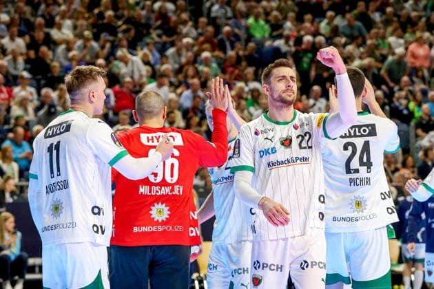 19 04 2026, xsscx, Handball, DHB Pokal Lidl Final4, Final, Füchse Berlin Bergischer HC, Season 2025 2026 Men, Lanxess Arena, Cologne Lasse Andersson Füchse Berlin 11 and Nejc Cehte Füchse Berlin 22 celebrate Dejan Milosavljev Füchse Berlin 96 after a prevented goal Photo xSandraxScherningxPressefotoKochx Nordrhein Westfalen Germany