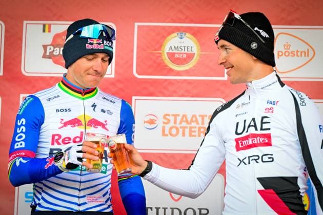 Danish Mattias Skjelmose of Lidl-Trek, Belgian Remco Evenepoel of Red Bull-BORA-hansgrohe and French Benoit Cosnefroy of UAE Team Emirates-XRG celebrate on the podium after the men elite Amstel Gold Race one day cycling race, 257,4 km from Maastricht to Valkenburg, The Netherlands, Sunday 19 April 2026. DIRKxWAEM  x171345663x