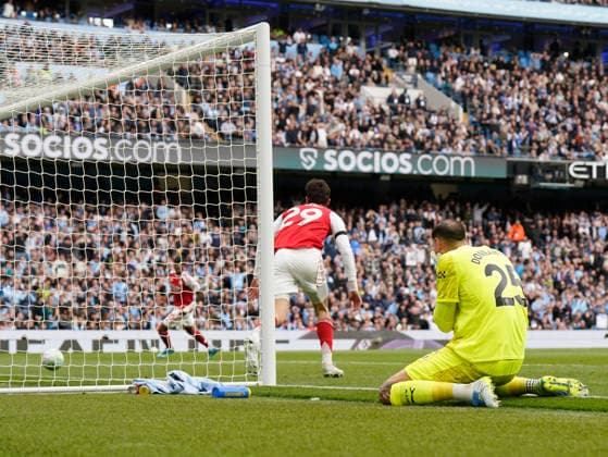 Manchester, England, 19th April 2026. Kai Havertz of Arsenal turns away to celebrate after intercepting a kick by Gianluigi Donnarumma of Manchester City to equalise during the Manchester City vs Arsenal Premier League match at the Etihad Stadium, Manchester. Picture credit should read: Andrew Yates Sportimage EDITORIAL USE ONLY. No use with unauthorised audio, video, data, fixture lists, club league logos or live services. Online in-match use limited to 120 images, no video emulation. No use in betting, games or single club league player publications. SPI_043_AY_Man_City_Arsenal SPI-4704-0043