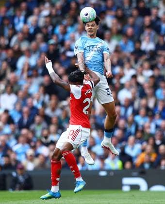 Nico O Reilly of Manchester City and Noni Madueke of Arsenal Manchester City v Arsenal, Premier League, Football, Etihad Stadium, Manchester, UK - 19 Apr 2026Manchester Etihad Stadium United Kingdom EDITORIAL USE ONLY No use with unauthorised audio, video, data, fixture lists, club league logos or live services. Online in-match use limited to 120 images, no video emulation. No use in betting, games or single club league player publications. Copyright: xMattxWest Shutterstockx 16836204v