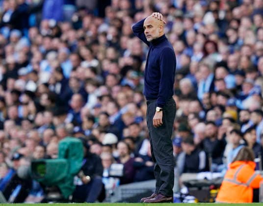 Manchester, England, 19th April 2026. Pep Guardiola coach of Manchester City looks on during the Manchester City vs Arsenal Premier League match at the Etihad Stadium, Manchester. Picture credit should read: Andrew Yates Sportimage EDITORIAL USE ONLY. No use with unauthorised audio, video, data, fixture lists, club league logos or live services. Online in-match use limited to 120 images, no video emulation. No use in betting, games or single club league player publications. SPI_080_AY_Man_City_Arsenal SPI-4704-0079