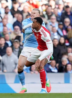 Manchester, England, 19th April 2026. Erling Haaland of Manchester City tussles with Gabriel of Arsenal during the Manchester City vs Arsenal Premier League match at the Etihad Stadium, Manchester. Picture credit should read: Andrew Yates Sportimage EDITORIAL USE ONLY. No use with unauthorised audio, video, data, fixture lists, club league logos or live services. Online in-match use limited to 120 images, no video emulation. No use in betting, games or single club league player publications. SPI_094_AY_Man_City_Arsenal SPI-4704-0094