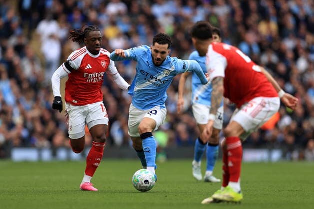 19th April 2026; Etihad Stadium, Manchester, Lancashire, England; Premier League Football, Manchester City versus Arsenal ; Rayan Cherki of Manchester City takes on Eberechi Eze of Arsenal DavidxBlunsden