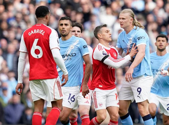 Manchester, England, 19th April 2026. Gabriel of Arsenal and Erling Haaland of Manchester City are kept apart during the Manchester City vs Arsenal Premier League match at the Etihad Stadium, Manchester. Picture credit should read: Andrew Yates Sportimage EDITORIAL USE ONLY. No use with unauthorised audio, video, data, fixture lists, club league logos or live services. Online in-match use limited to 120 images, no video emulation. No use in betting, games or single club league player publications. SPI_108_AY_Man_City_Arsenal SPI-4704-0107