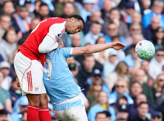Manchester, England, 19th April 2026. Gabriel of Arsenal tussles with Erling Haaland of Manchester City during the Manchester City vs Arsenal Premier League match at the Etihad Stadium, Manchester. Picture credit should read: Andrew Yates Sportimage EDITORIAL USE ONLY. No use with unauthorised audio, video, data, fixture lists, club league logos or live services. Online in-match use limited to 120 images, no video emulation. No use in betting, games or single club league player publications. SPI_109_AY_Man_City_Arsenal SPI-4704-0108