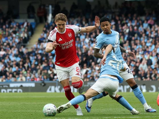 19th April 2026; Etihad Stadium, Manchester, Lancashire, England; Premier League Football, Manchester City versus Arsenal ; Bernardo Silva of Manchester City tackles Martin Odegard of Arsenal DavidxBlunsden