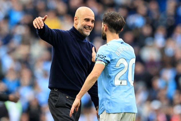 19th April 2026; Etihad Stadium, Manchester, Lancashire, England; Premier League Football, Manchester City versus Arsenal ; Manchester City manager Pep Guardiola celebrates with Bernardo Silva at full time DavidxBlunsden