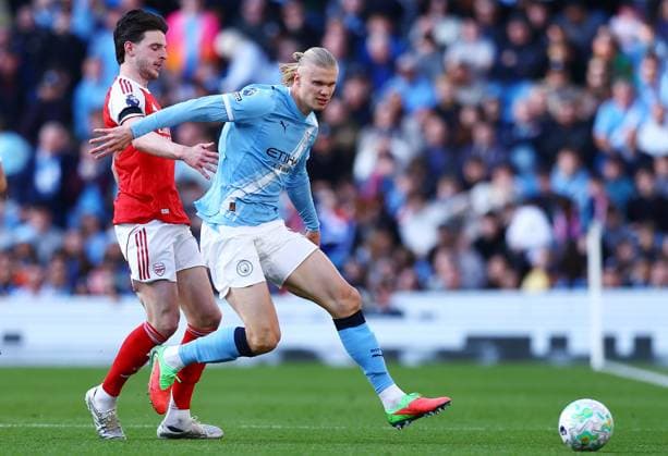 Erling Haaland of Manchester City and Declan Rice of Arsenal Manchester City v Arsenal, Premier League, Football, Etihad Stadium, Manchester, UK - 19 Apr 2026Manchester Etihad Stadium United Kingdom EDITORIAL USE ONLY No use with unauthorised audio, video, data, fixture lists, club league logos or live services. Online in-match use limited to 120 images, no video emulation. No use in betting, games or single club league player publications. Copyright: xMattxWest Shutterstockx 16836204br