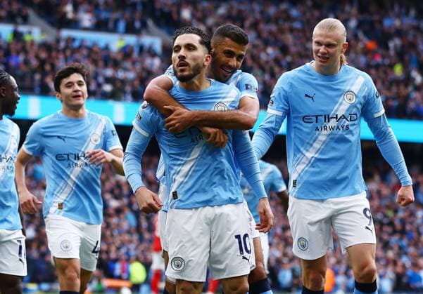 Rayan Cherki of Manchester City celebrates scoring the opening goal with their team-mates Manchester City v Arsenal, Premier League, Football, Etihad Stadium, Manchester, UK - 19 Apr 2026Manchester Etihad Stadium United Kingdom EDITORIAL USE ONLY No use with unauthorised audio, video, data, fixture lists, club league logos or live services. Online in-match use limited to 120 images, no video emulation. No use in betting, games or single club league player publications. Copyright: xMattxWest Shutterstockx 16836204dh