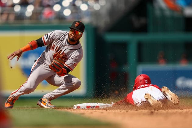 MLB, Baseball Herren, USA San Francisco Giants vs Washington Nationals Washington, DC; Washington Nationals shortstop Nasim Nunez (26) slides safely after stealing second base as San Francisco Giants infielder Luis Arraez (1) catches the throw during the Major League Baseball game at Nationals Park on Sunday, April 19, 2026. The Nationals beat the Giants 3-0. (Steve Prakope Image of Washington District of Columbia United States EDITORIAL USE ONLY Copyright: xImagexofxSportx StevexPrakopex iosphotos406576