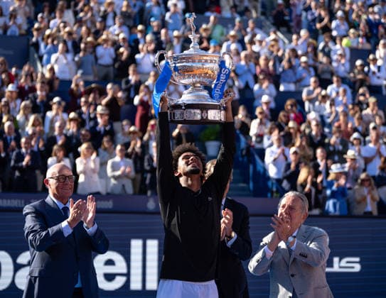 (260420) -- BARCELONA, April 20, 2026 -- Arthur Fils (C) of France poses with the trophy during the awarding ceremony for the men s singles final tennis match between Arthur Fils of France and Andrey Rublev of Russia at the ATP, Tennis Herren Barcelona Open Banc Sabadell 2026 in Barcelona, Spain, on April 19, 2026. (Photo by Xinhua) (SP)SPAIN-BARCELONA-TENNIS-ATP-BARCELONA OPEN-MEN S SINGLES-FINAL JoanxGosa 