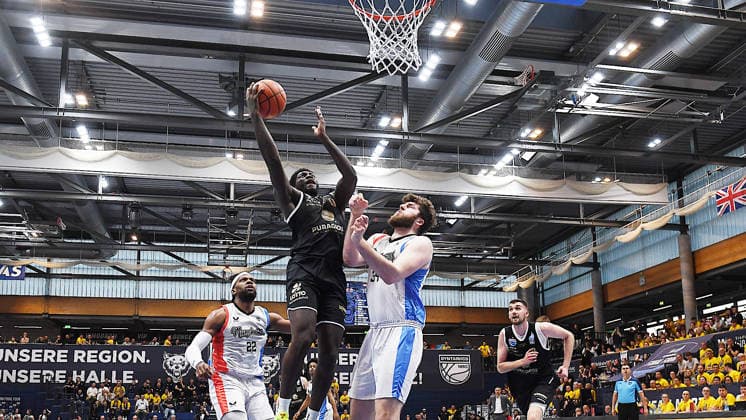 Basketball, ENBL VIMODROM Final Four 2026, Semi-final, SYNTAINICS MBC Mitteldeutscher Basketball Club Weissenfels vs Manchester Basketball 22 04 2026 86 89 49 42 Duel for the ball at the basket between Khyri Thomas Guard Syntainics MBC, back number 0 left and Matthew Matt Nicholson Center Manchester Basketball, back number 34 right during the game MBC Weißenfels vs Manchester Basketball 22 04 2026 Weißenfels Saxony Anhalt Germany Stadthalle Weißenfels