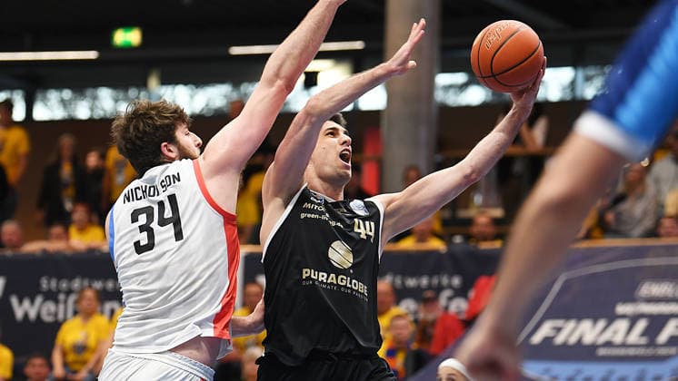 Basketball, ENBL VIMODROM Final Four 2026, Semi-final, SYNTAINICS MBC Mitteldeutscher Basketball Club Weissenfels vs Manchester Basketball 22 04 2026 86 89 49 42 Duel for the ball between Jure Planinic Center Syntainics MBC, back number 44 right and Matthew Matt Nicholson Center Manchester Basketball, back number 34 left during the game MBC Weißenfels vs Manchester Basketball 22 04 2026 Weißenfels Saxony Anhalt Germany Stadthalle Weißenfels