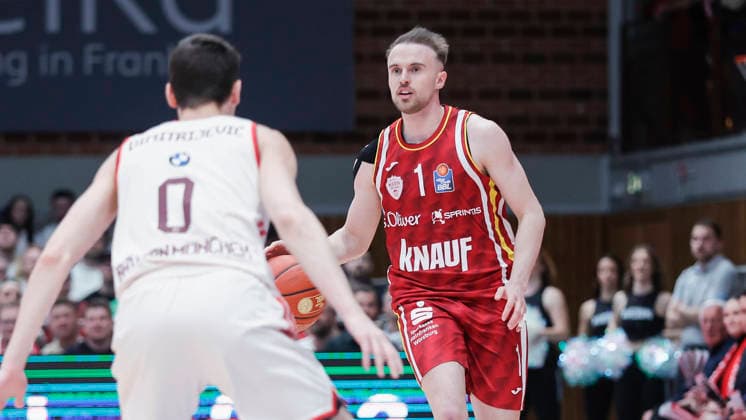 In the picture from left Nenad Dimitrijevic FC Bayern Muenchen Basketball, 0 against Lukas Herzog Wuerzburg Baskets, 1 on the ball 23 04 2026, Basketball, Fitness First Wuerzburg Baskets vs FC Bayern Muenchen Basketball, easyCredit BBL, 26 Matchday, Germany, 97072, tectake Arena Wuerzburg, Copyright: HMBxMedia xJulienxBecker