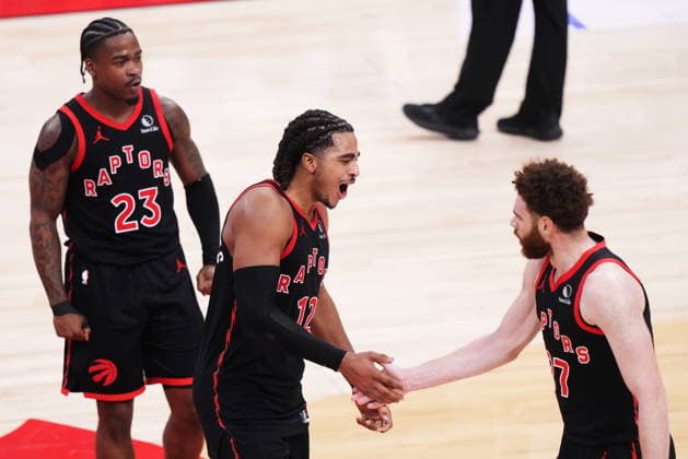 April 23, 2026, Toronto, On, Canada: Toronto Raptors Jamal Shead (23), Collin Murray-Boyles (12) and Jamison Battle (77) celebrate a basket against the Cleveland Cavaliers during second half NBA, Basketball Herren, USA playoff basketball action in Toronto on Thursday, April 23, 2026. Canada News - April 23, 2026 - ZUMAc35_ 20260423_zaf_c35_134 Copyright: xNathanxDenettex