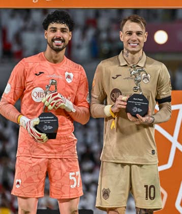 Al Rayyan SC vs Al-Shabab SC AGCFF Gulf Club Champions League Final Mahmud Abunada (L) of Al Rayyan SC (Best Goalkeeper ),Roger Guedes (R) of Al Rayyan SC (Best player) pose with the trophies during an award ceremony for the AGCFF Gulf Club Champions League Final football match between QatarÕs Al Rayyan SC and Saudi Arabia s Al-Shabab SC at Ahmad bin Ali Stadium in Al Rayyan, Qatar, on April 23, 2026. DOHA Qatar Copyright: xNOUSHADx
