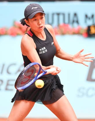 (260424) -- MADRID, April 24, 2026 -- Zhang Shuai hits a return during the women s singles round of 64 match between Zhang Shuai of China and Anastasia Potapova of Austria at the 2026 Madrid Open tennis tournament in Madrid, Spain, on April 24, 2026. ) (SP)SPAIN-MADRID-TENNIS-MADRID OPEN-WOMEN S SINGLES ChengxMin 