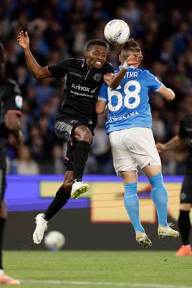 Italy: Serie a football match SSC Napoli vs Cremonese Cremonese s Nigerian forward David Okereke challenges for the ball with Stanislav Lobotka during the Serie A football match between SSC Napoli vs Cremonese at the Diego Armando Maradona Stadium in Naples, on April 24, 2026. _BPH2712 Copyright: xAntonioxBalascox