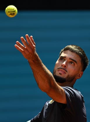 (260425) -- MADRID, April 25, 2026 -- Dino Prizmic serves during the men s singles round of 64 match between Dino Prizmic of Croatia and Ben Shelton of the United States at the 2026 Madrid Open tennis tournament in Madrid, Spain, on April 24, 2026. ) (SP)SPAIN-MADRID-TENNIS-MADRID OPEN-MEN S SINGLES ChengxMin 