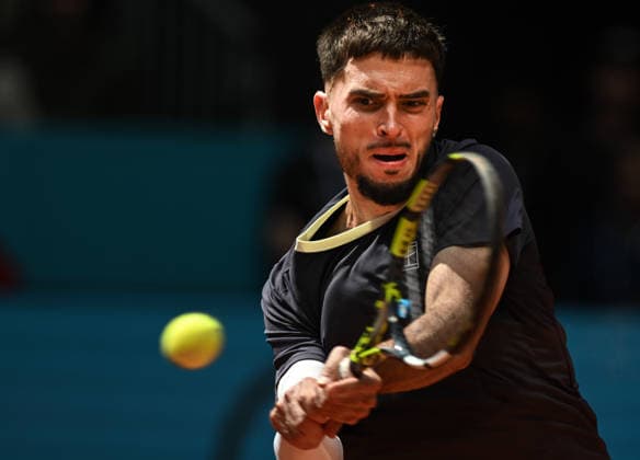 (260425) -- MADRID, April 25, 2026 -- Dino Prizmic hits a return during the men s singles round of 64 match between Dino Prizmic of Croatia and Ben Shelton of the United States at the 2026 Madrid Open tennis tournament in Madrid, Spain, on April 24, 2026. ) (SP)SPAIN-MADRID-TENNIS-MADRID OPEN-MEN S SINGLES ChengxMin 