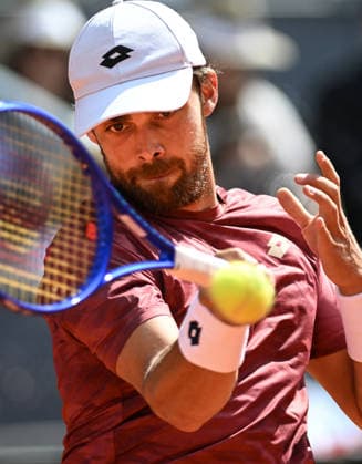 (260425) -- MADRID, April 25, 2026 -- Benjamin Bonzi of France hits a return during the men s singles round of 64 match between Jannik Sinner of Italy and Benjamin Bonzi of France in Madrid, Spain, on April 24, 2026. ) (SP)SPAIN-MADRID-TENNIS-MADRID OPEN-MEN S SINGLES ChengxMin 