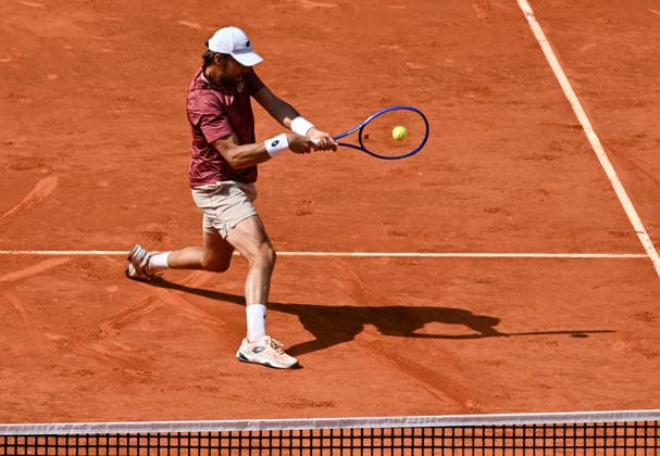 (260425) -- MADRID, April 25, 2026 -- Benjamin Bonzi of France hits a return during the men s singles round of 64 match between Jannik Sinner of Italy and Benjamin Bonzi of France in Madrid, Spain, on April 24, 2026. ) (SP)SPAIN-MADRID-TENNIS-MADRID OPEN-MEN S SINGLES ChengxMin 