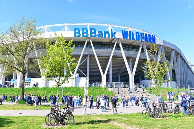 Visitors walk to the stadium during spring time before the 2 Bundesliga match between Karlsruher SC and Hannover 96 at BBBank Wildpark on April 25, 2026 in Karlsruhe, Germany Photo by Silas Schüller DeFodi Images Visitors walk to the stadium during spring time before the 2 Bundesliga match between Karlsruher SC and Hannover 96 at BBBank Wildpark on April 25, 2026 in Karlsruhe, Germany Photo by Silas Schüller DeFodi Images DFB DFL REGULATIONS PROHIBIT ANY USE OF PHOTOGRAPHS AS IMAGE SEQUENCES AND OR QUASI VIDEO Photo by Silas Schueller DeFodi Images