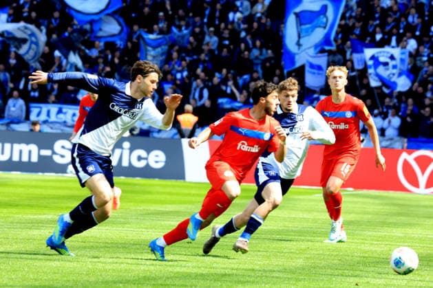 DEU, DFL, 2 FBL, Hertha BSC vs Holstein Kiel, 25 04 2026, Berliner Olympiastadion, Berlin, DEU, DFL, 2 FBL, Hertha BSC vs Holstein Kiel, in the picture Michael Cuisance Hertha BSC Berlin 10 , Linus Gechter Hertha BSC Berlin 44 , UMUT TOHUMCU Holstein Kiel 8 DFL regulations prohibit any use of Photographs as image sequences and or quasi video nordphotoxGmbHx xEngler nph00076