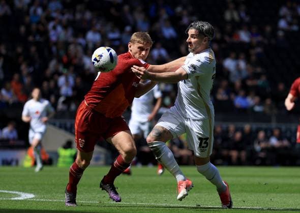 Laurence Maguire of Milton Keynes Dons in action against Nathan Smith of Tranmere Rovers Milton Keynes Dons v Tranmere Rovers, EFL Sky Bet League Two, Football, Stadium MK, Milton Keynes, UK - 25 Apr 2026Milton Keynes Stadium MK United Kingdom EDITORIAL USE ONLY No use with unauthorised audio, video, data, fixture lists, club league logos or live services. Online in-match use limited to 120 images, no video emulation. No use in betting, games or single club league player publications. Copyright: xGeorgexTewkesbury Shutterstockx 16838787v
