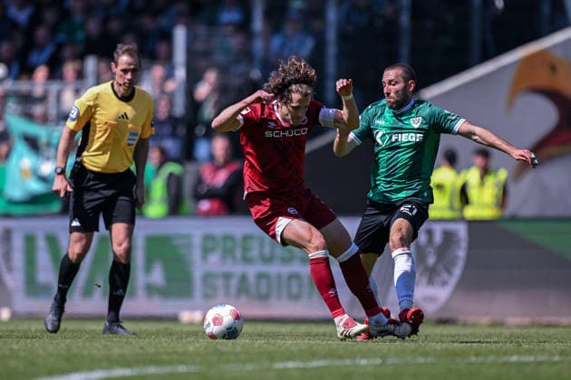 25 04 2026, Soccer, 2 Bundesliga, 31 Matchday Season 2025 2026, Preußen Münster DSC Arminia Bielefeld, Mael Corboz DSC Arminia Bielefeld , Rico Preißinger Preußen Münster xRHR PHOTO TKx Copyright: RHR-FOTOx RHR-FOTO TK