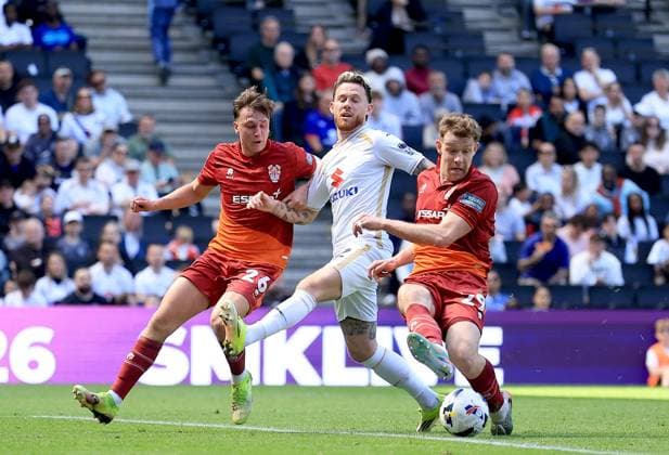 Gethin Jones of Milton Keynes Dons in action against James Plant (left) and Joe Ironside of Tranmere Rovers Milton Keynes Dons v Tranmere Rovers, EFL Sky Bet League Two, Football, Stadium MK, Milton Keynes, UK - 25 Apr 2026Milton Keynes Stadium MK United Kingdom EDITORIAL USE ONLY No use with unauthorised audio, video, data, fixture lists, club league logos or live services. Online in-match use limited to 120 images, no video emulation. No use in betting, games or single club league player publications. Copyright: xGeorgexTewkesbury Shutterstockx 16838787aa