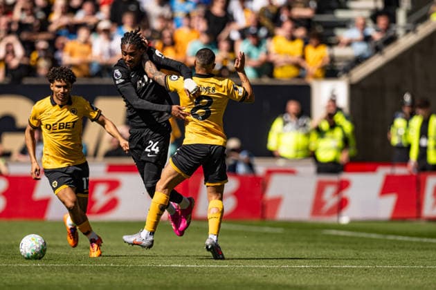 25th April 2026; Molineux Stadium, Wolverhampton, West Midlands, England; Premier League Football, Wolverhampton Wanderers versus Tottenham Hotspur; Djed Spence of Tottenham Hotspur is fouled by Joao Gomes of Wolverhampton Wanderers GodfreyxPitt