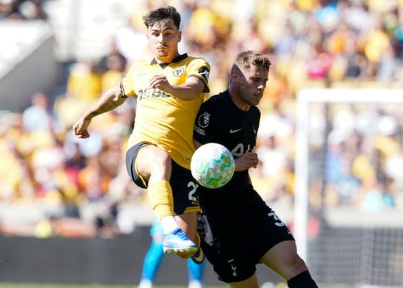 Wolverhampton, England, 25th April 2026. Rodrigo Gomes of Wolverhampton Wanderers (L) challenges Micky van de Ven of Tottenham during the Wolverhampton Wanderers vs Tottenham Hotspur Premier League match at Molineux, Wolverhampton. Picture credit should read: Andrew Yates Sportimage EDITORIAL USE ONLY. No use with unauthorised audio, video, data, fixture lists, club league logos or live services. Online in-match use limited to 120 images, no video emulation. No use in betting, games or single club league player publications. SPI_014_AY_WOLVES_SPURS SPI-4731-0015