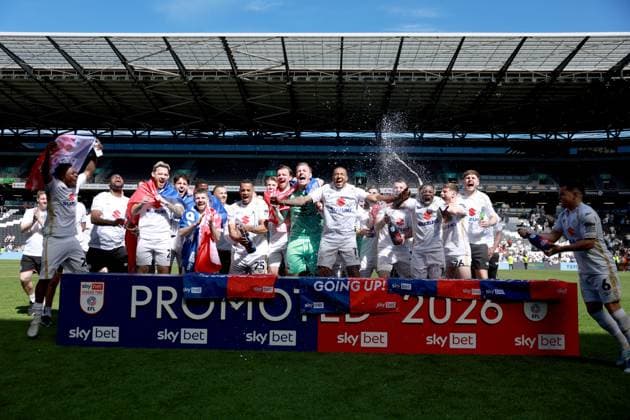 Milton Keynes Dons players celebrate their side s promotion to EFL League One Milton Keynes Dons v Tranmere Rovers, EFL Sky Bet League Two, Football, Stadium MK, Milton Keynes, UK - 25 Apr 2026Milton Keynes Stadium MK United Kingdom EDITORIAL USE ONLY No use with unauthorised audio, video, data, fixture lists, club league logos or live services. Online in-match use limited to 120 images, no video emulation. No use in betting, games or single club league player publications. Copyright: xGeorgexTewkesbury Shutterstockx 16838787bn