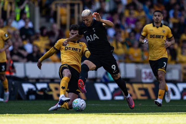 25th April 2026; Molineux Stadium, Wolverhampton, West Midlands, England; Premier League Football, Wolverhampton Wanderers versus Tottenham Hotspur; Richarlison of Tottenham Hotspur is tackled by Santiago Bueno of Wolverhampton Wanderers GodfreyxPitt