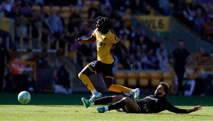 Wolverhampton, England, 25th April 2026. Mateus ManÃ of Wolverhampton Wanderers (L) is tackled by Rodrigo Bentancur of Tottenham during the Wolverhampton Wanderers vs Tottenham Hotspur Premier League match at Molineux, Wolverhampton. Picture credit should read: Andrew Yates Sportimage EDITORIAL USE ONLY. No use with unauthorised audio, video, data, fixture lists, club league logos or live services. Online in-match use limited to 120 images, no video emulation. No use in betting, games or single club league player publications. SPI_023_AY_WOLVES_SPURS SPI-4731-0034