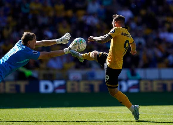 Wolverhampton, England, 25th April 2026. Antonin KinskÃ½ of Tottenham (L) saves from Adam Armstrong of Wolverhampton Wanderers during the Wolverhampton Wanderers vs Tottenham Hotspur Premier League match at Molineux, Wolverhampton. Picture credit should read: Andrew Yates Sportimage EDITORIAL USE ONLY. No use with unauthorised audio, video, data, fixture lists, club league logos or live services. Online in-match use limited to 120 images, no video emulation. No use in betting, games or single club league player publications. SPI_035_AY_WOLVES_SPURS SPI-4731-0036