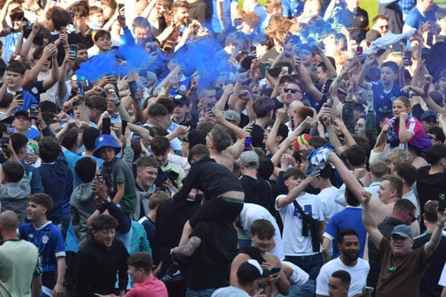 Football - 2025 2026 EFL Sky Bet League One - Cardiff City vs. Northampton Town - Cardiff City Stadium - Saturday 24th April 2026 pITCH INVASION BY CARDIFF FANS HOLDS UP PRESENTATION Pic- COLORSPORT Winston Bynorth 